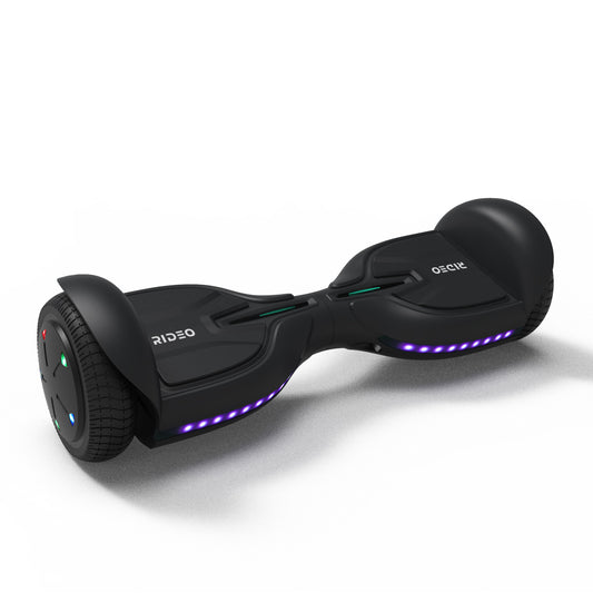 Dynamic portrayal of a blue RIDEO Q3-C hoverboard in a modern, architectural environment, highlighting its sleek design and vibrant undercarriage lighting.