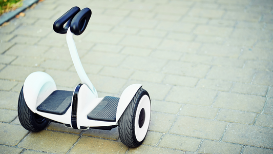 A white and black Segway on a brick walkway, providing a convenient and stylish mode of rideo hoverboard