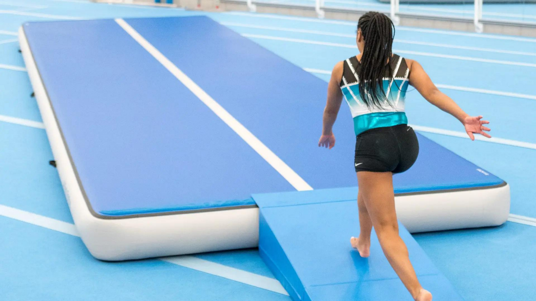 A woman walking on an inflatable track, enjoying a unique exercise experience on blue rideo air track.