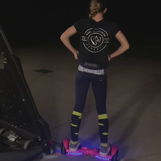 In the dim light, a girl skillfully rides hoverboard. The scene captures her joyful moments, showcasing her basketball skills and playful interactions with her pet. A perfect blend of fun and companionship.